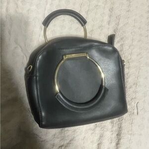 Elegant Black Handbag with Gold Accents